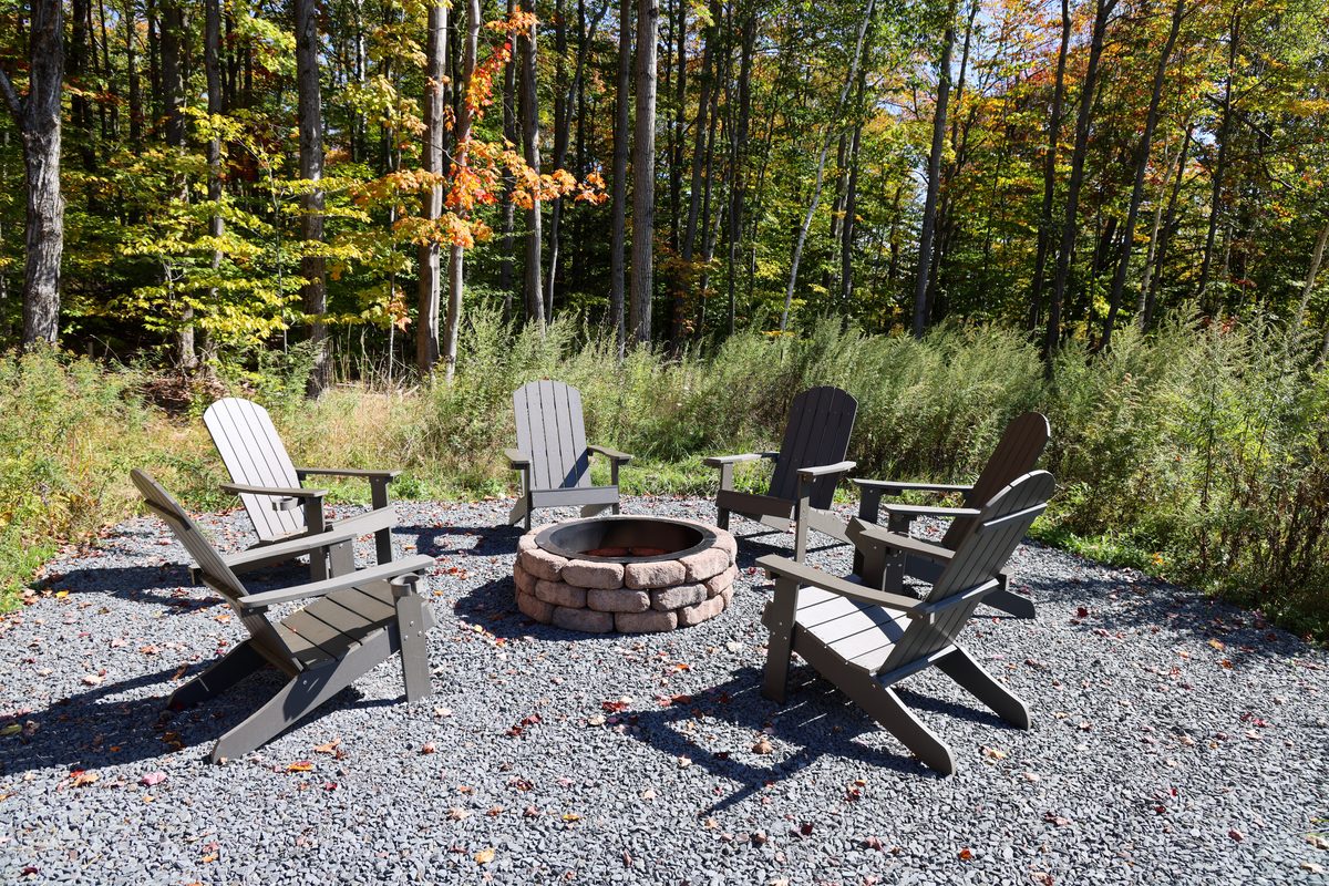 The fire pit and Adirondack chairs